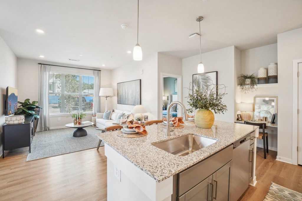 an open floor plan with a kitchen and living room