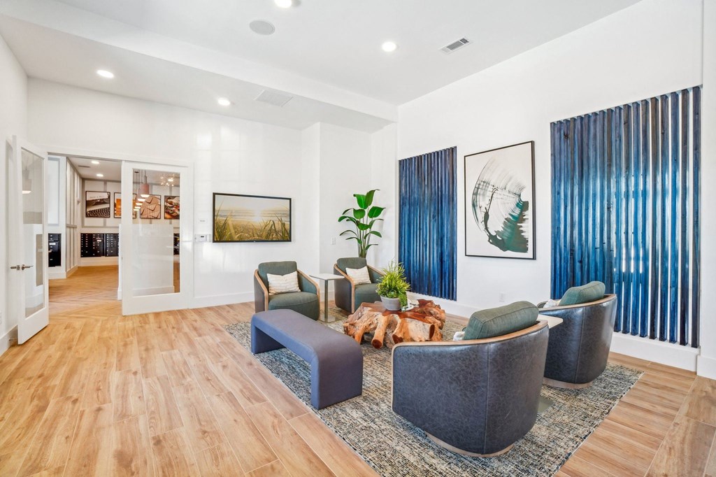 a living room with a couch and chairs