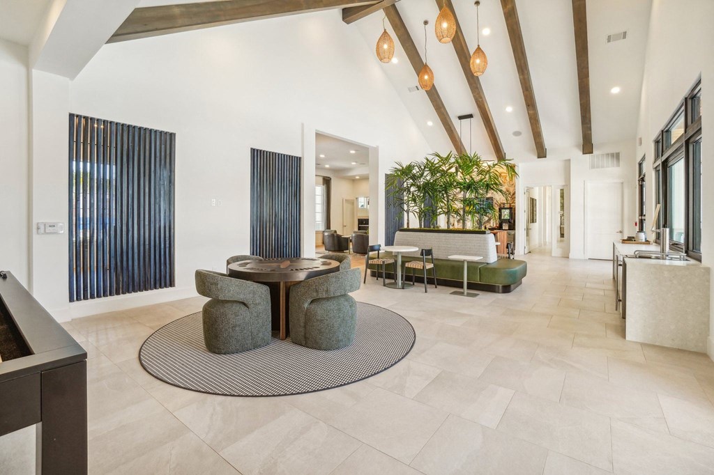 a living room with a fireplace and a table