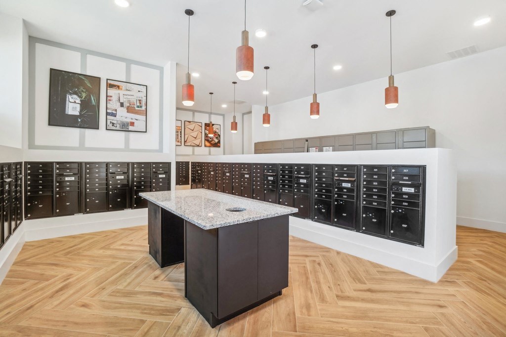 a large wine tasting room with a granite counter top in the center of the room