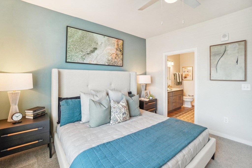 a bedroom with a large bed and a closet