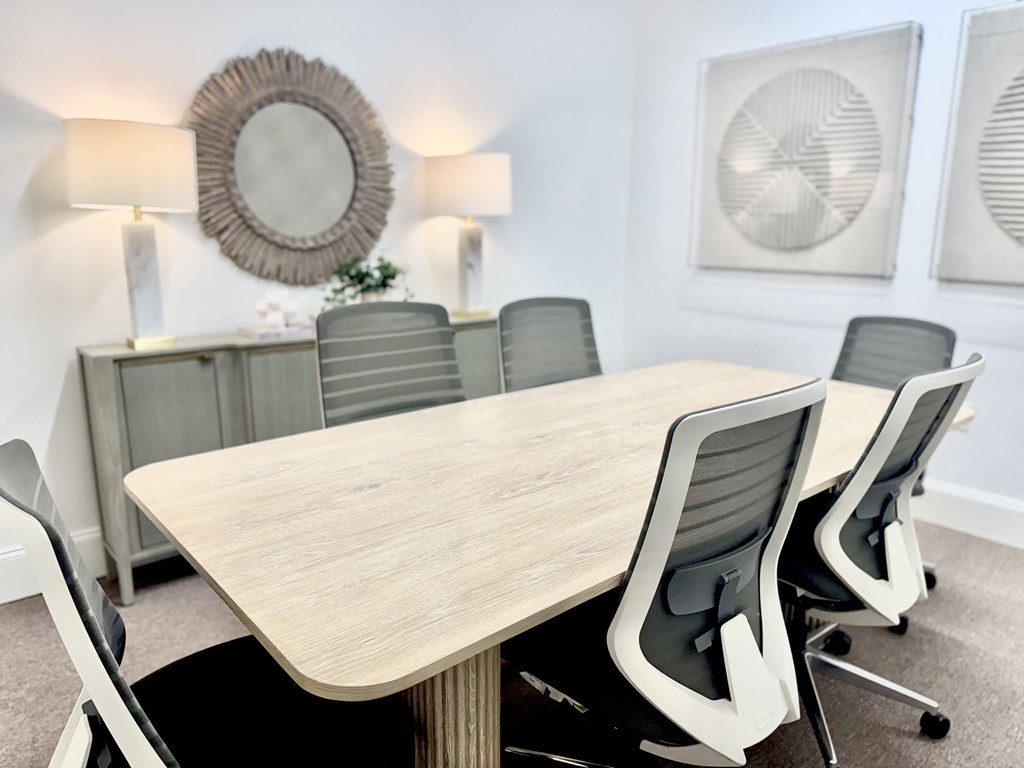 A conference room with a large table and chairs at Reserve of Foley Apartments in Foley AL