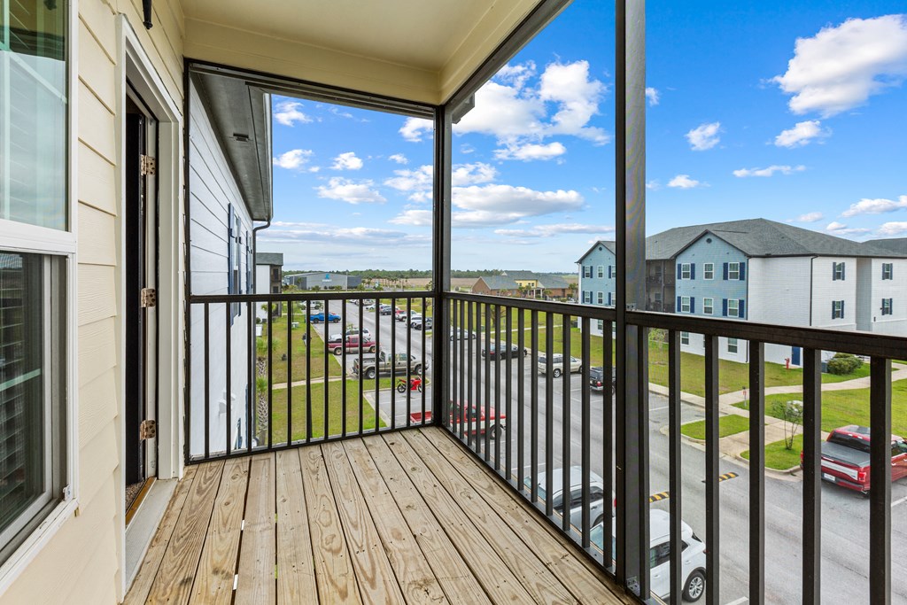 a balcony with a view of a parking lot