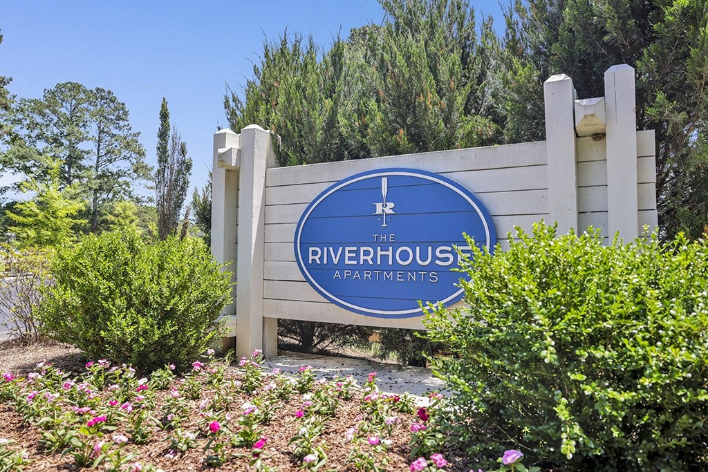 the entrance sign at Riverhouse Apartments in Riverside, AL