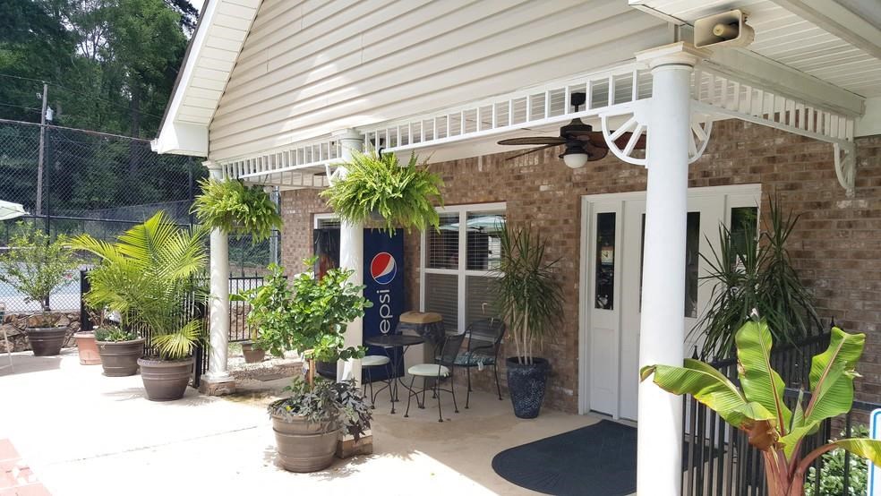 a porch with a sign on the side of a building