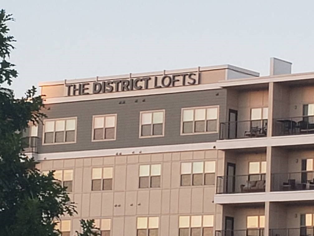 a large building with the district lodges on top of it