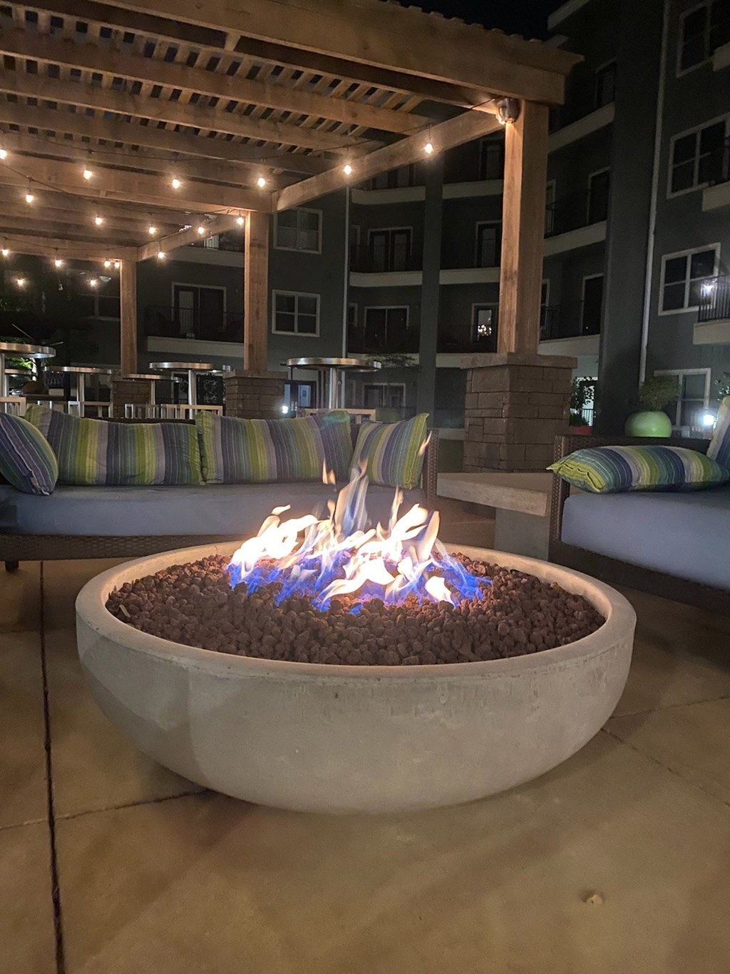 a fire pit in the middle of a patio