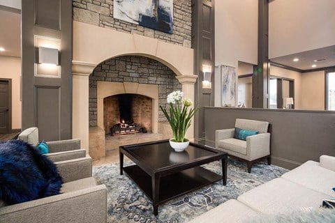 a living room with a fireplace and couches