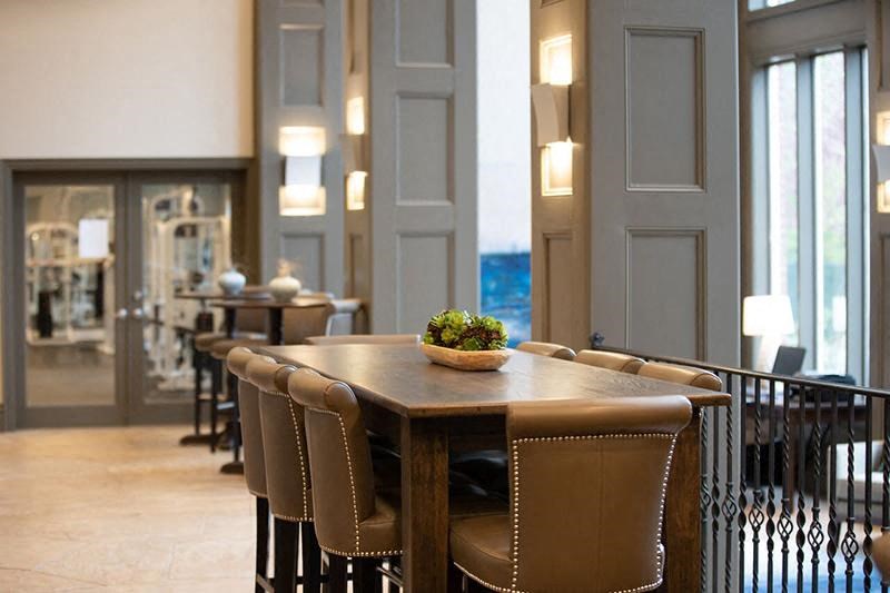 a dining room with a table and chairs