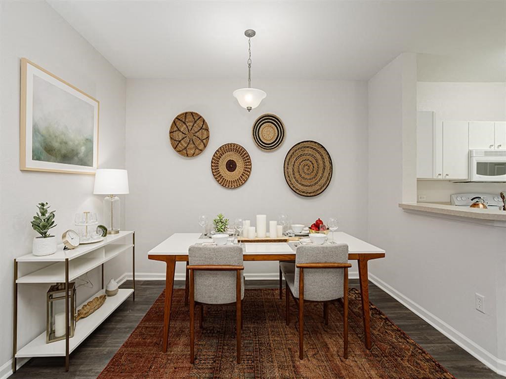 a dining room with a table and chairs