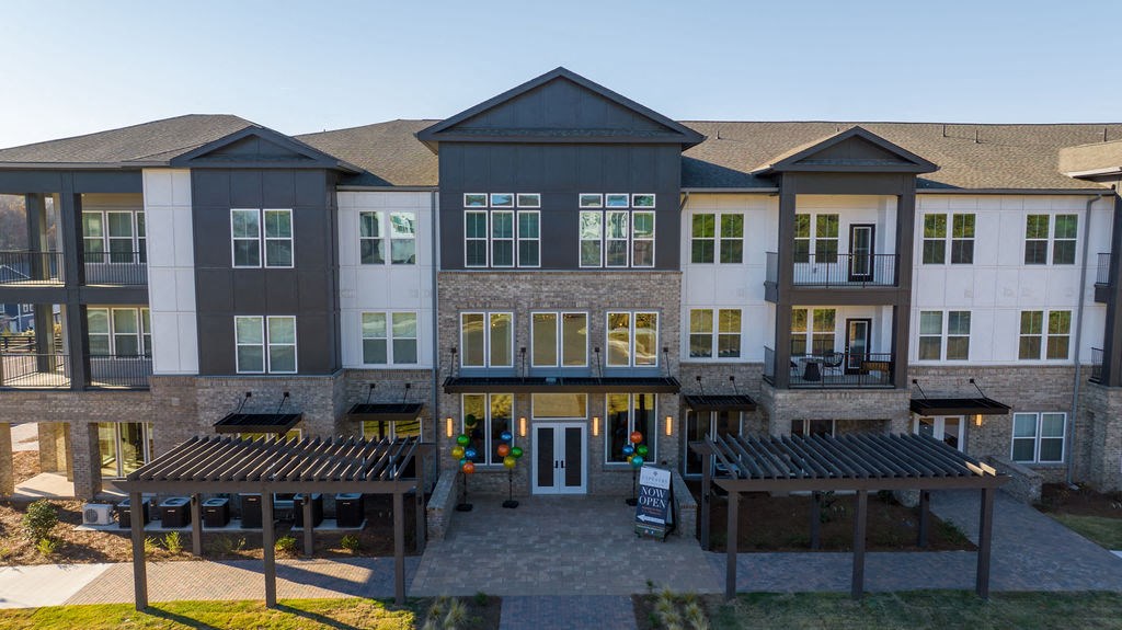 an aerial view of an apartment building at dusk
