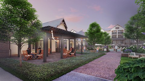 A modern building with a garden in front.