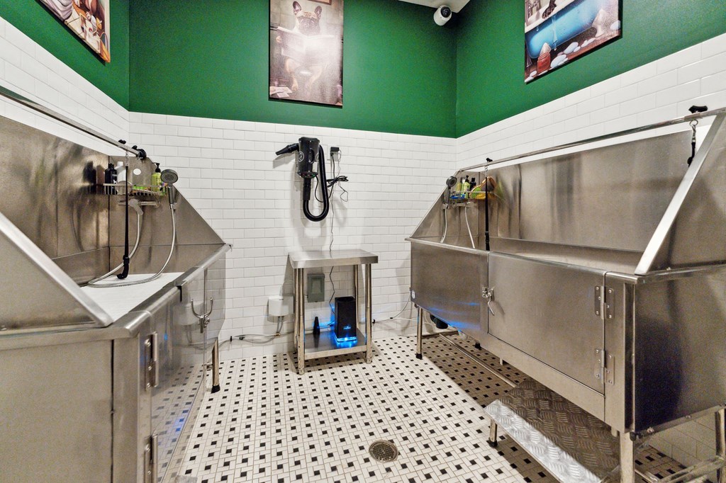 a brewery with three stainless steel fermentation tanks