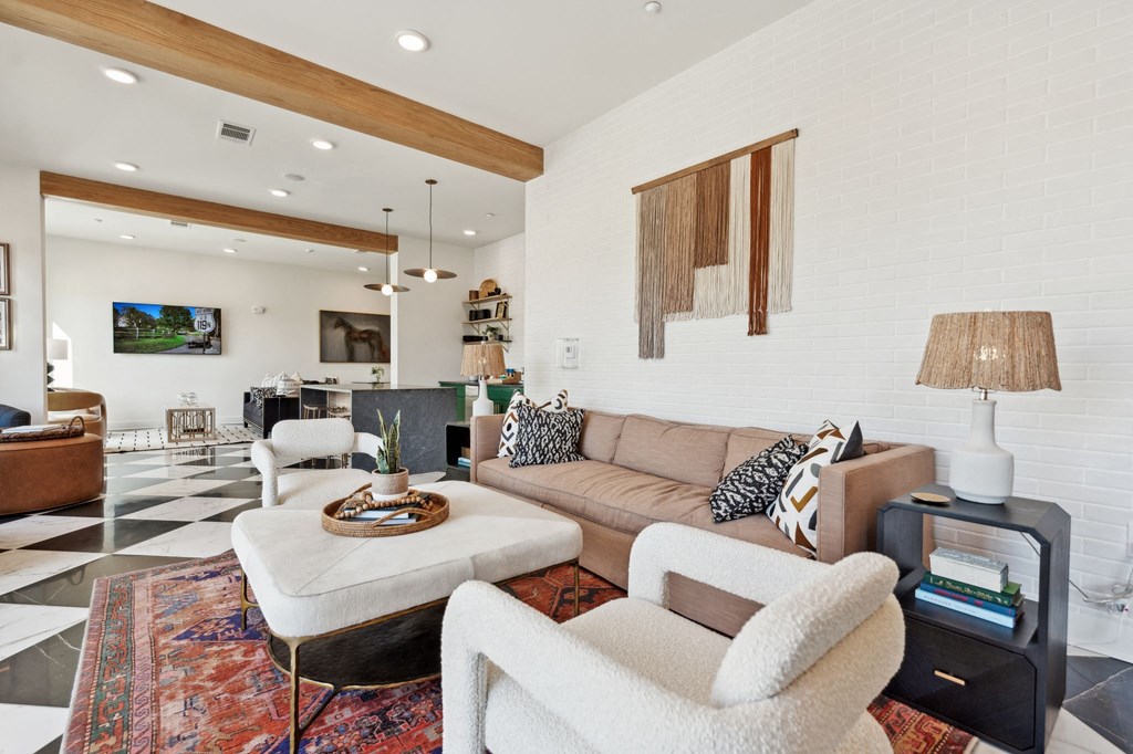 a living room filled with furniture and a checkered floor