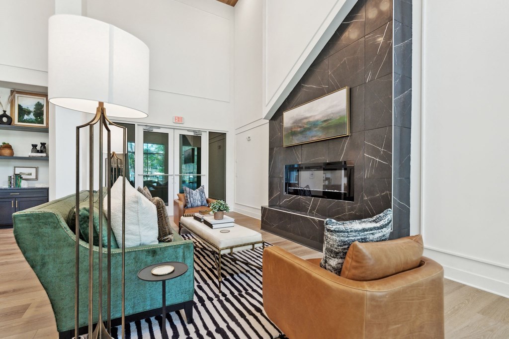 a living room with couches and a fireplace