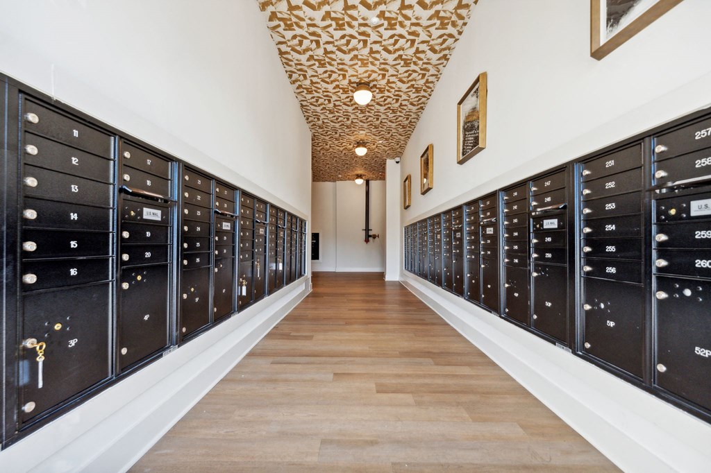 a long hallway with vaulted ceilings and a row of lockers