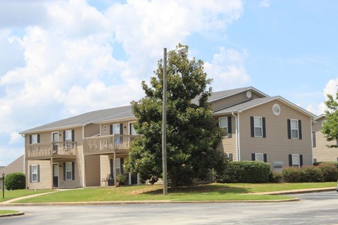 A large apartment building at The Avery at Auburn Apartments in Auburn, AL