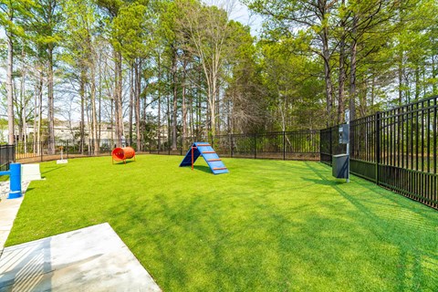 A playground with a slide, ball pit, and trampoline.