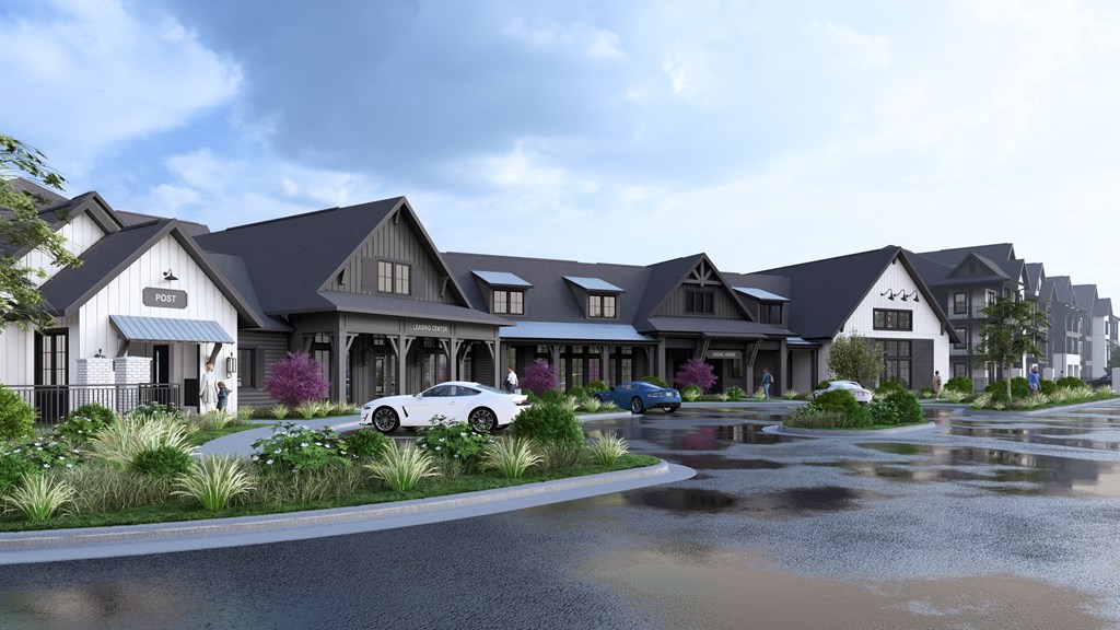 A row of houses with cars parked in front.