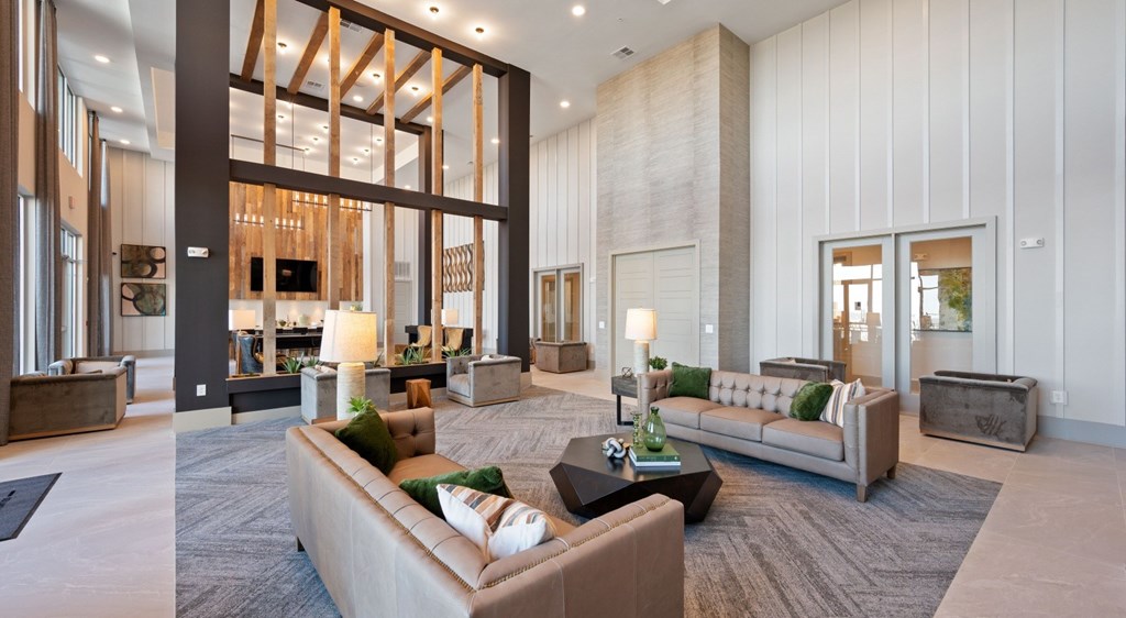 A modern living room with a large couch and a coffee table.