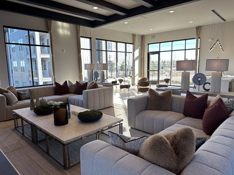 A living room with a large couch and a coffee table.