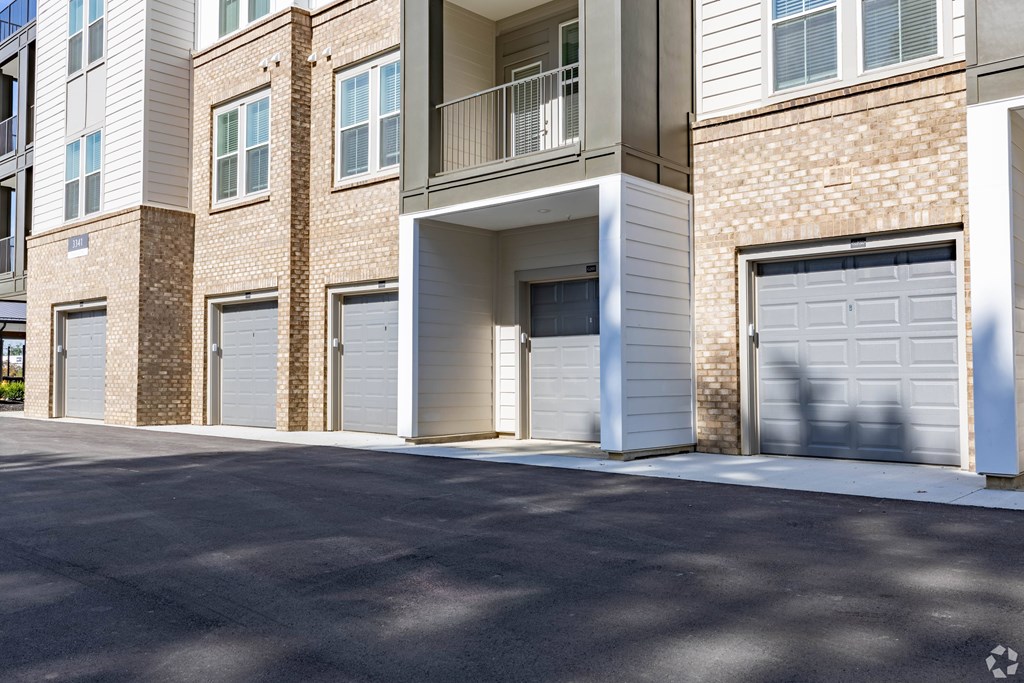 A building with a white garage door in front.