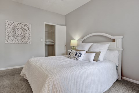 Bedroom and closet at Village at Caldwell Mill Apartments in Birmingham, AL