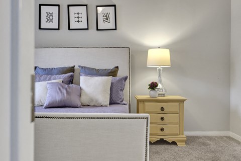 Bedroom with plush carpet Village at Caldwell Mill Apartments in Birmingham, AL
