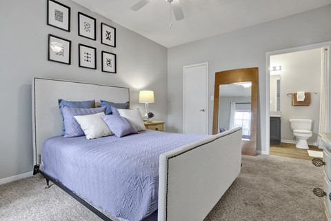 Bedroom with en-suite bathroom at Village at Caldwell Mill Apartments in Birmingham, AL