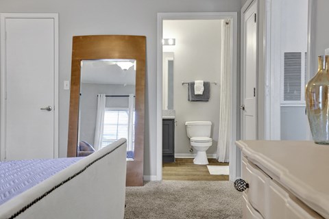 Bedroom with en-suite bathroom at Village at Caldwell Mill Apartments in Birmingham, AL