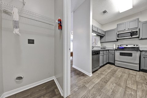 laundry room off of the kitchen at Village at Caldwell Apartments in Birmingham, AL