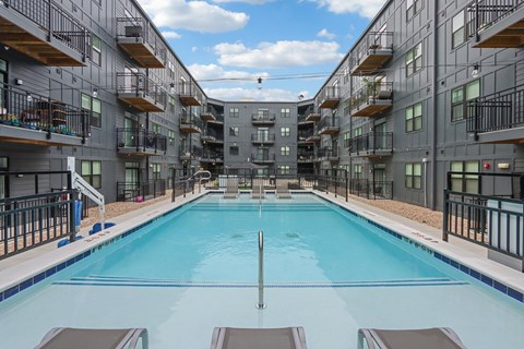 A large swimming pool in a residential building.