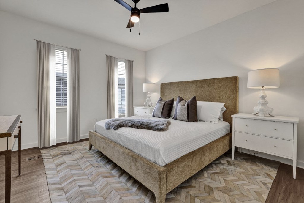 Bedroom with ceiling fan and tall ceilings at West Row Townhomes and at West Row Townhomes at West Row Lofts and Townhomes in Birmingham, AL