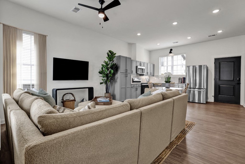 Open floor plan with wood-style flooring at West Row Townhomes and at West Row Townhomes at West Row Lofts and Townhomes in Birmingham, AL