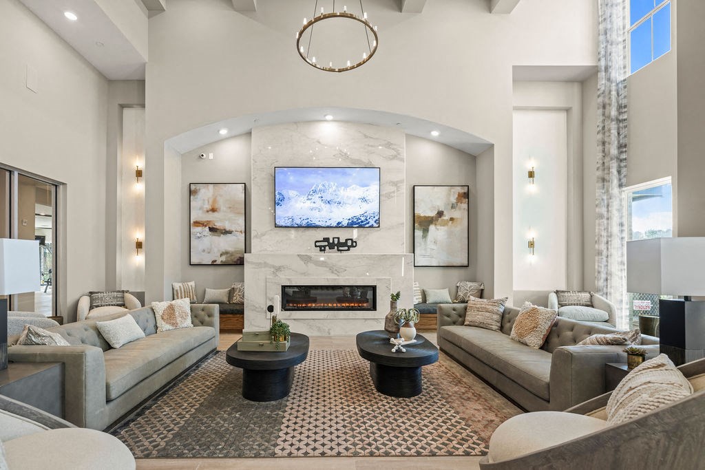 a living room with couches and a fireplace