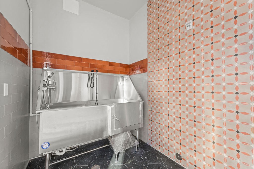 a bathroom with a large sink and a mirror