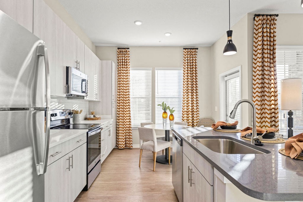 a kitchen with stainless steel appliances and a counter top