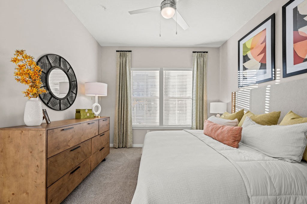 a bedroom with a large bed and a window