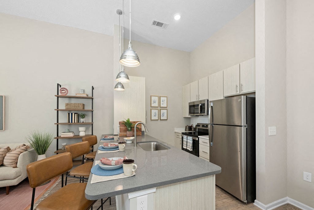 a kitchen with stainless steel appliances and a counter top