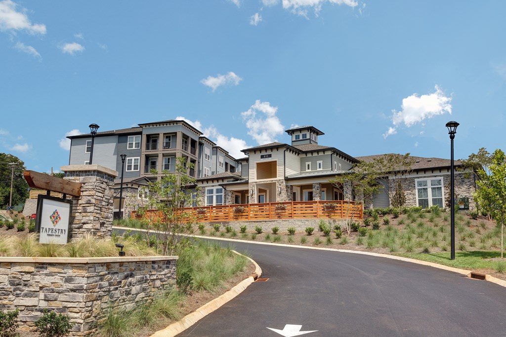 a view of a building with a road in front of it