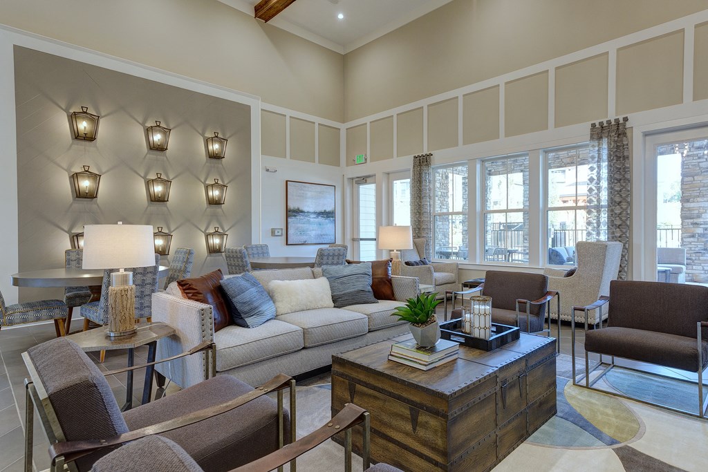 a living room with couches and chairs and a table