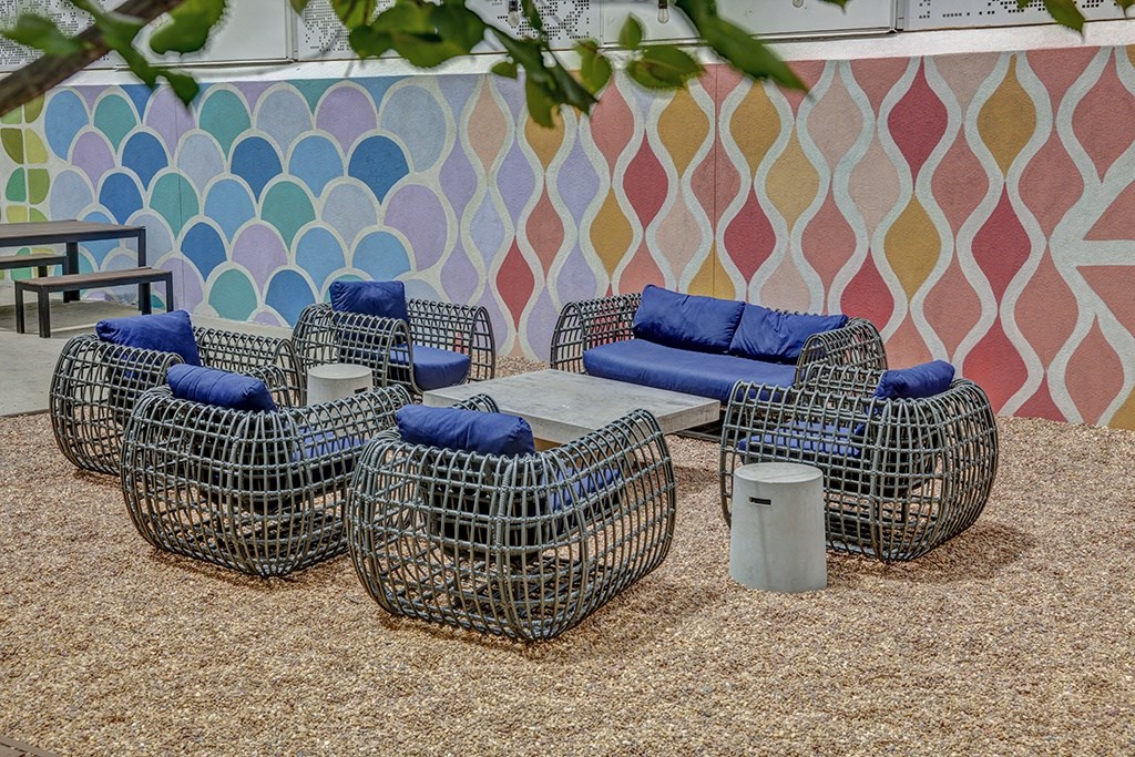 a group of chairs and tables in a room