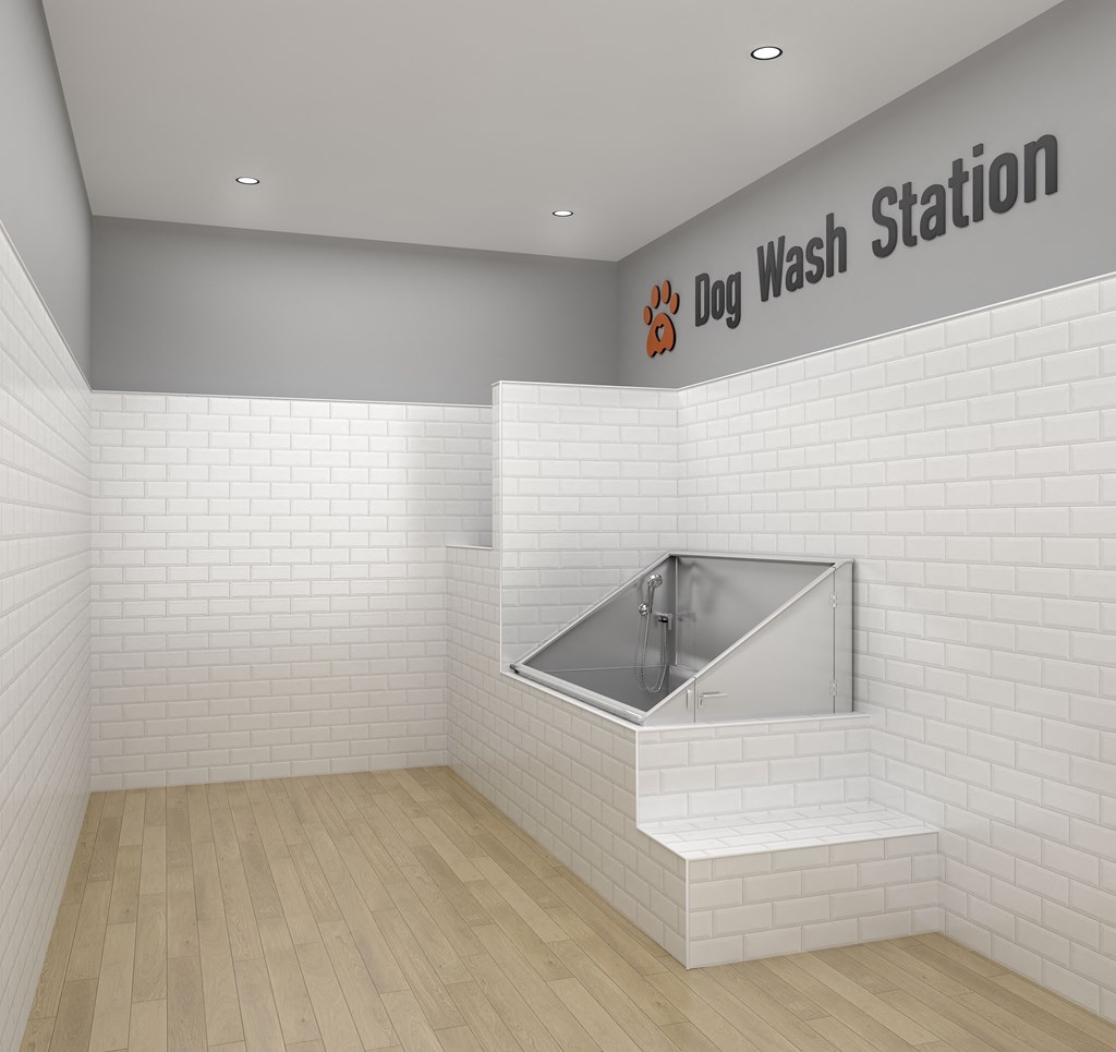 a view of a white subway tile bathroom with a sink