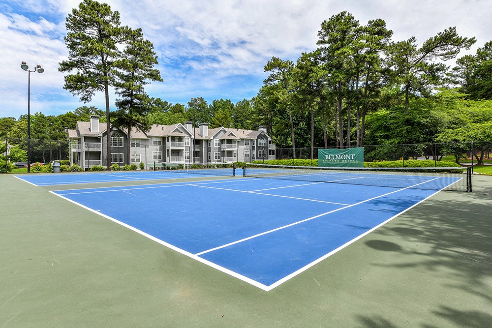 the tennis court at the estates apartments