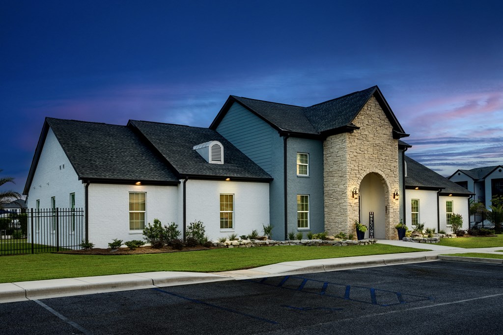 a home with a dark blue roof and white walls