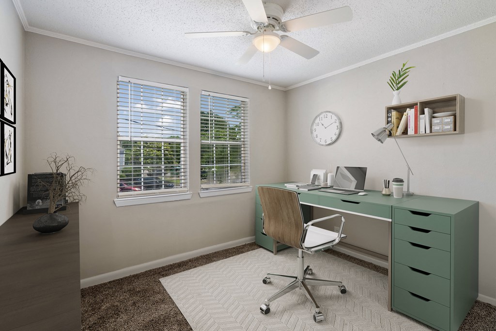 bedrooms with natural light and ceiling fans  Living Room with wood flooring at Midtown Oaks Townhomes in Mobile, AL