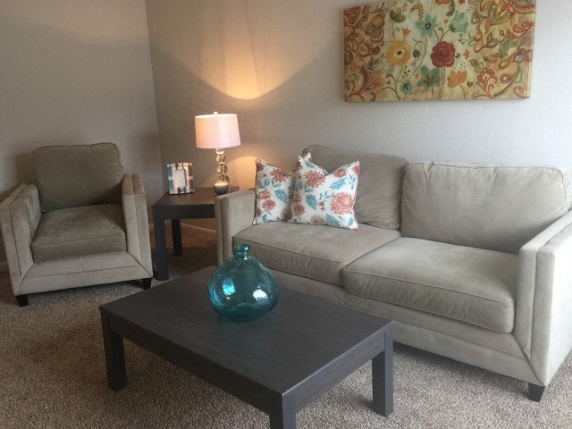 a living room with a couch and a coffee table