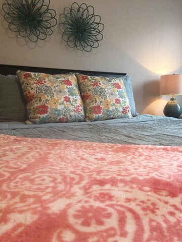 a bed with two pillows on top of it