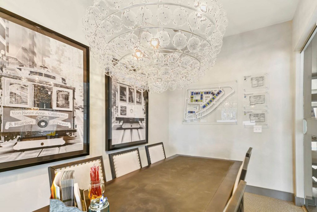 a dining room with a table and a chandelier