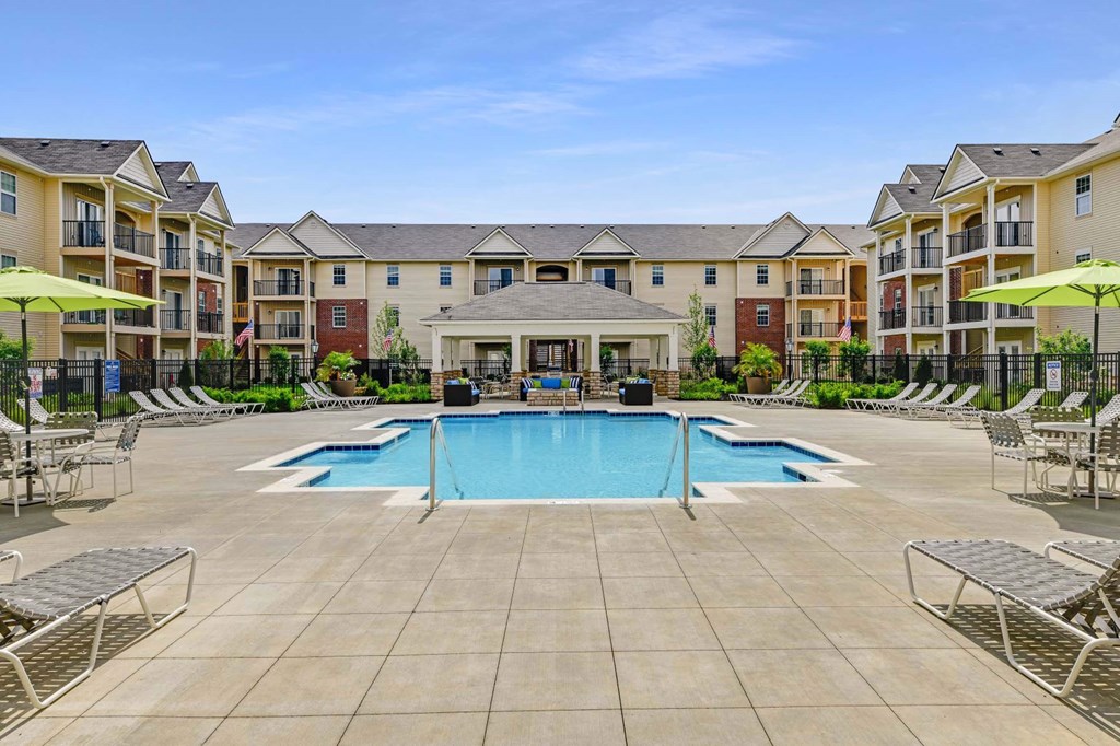 our apartments offer a swimming pool with a gazebo and an apartment building